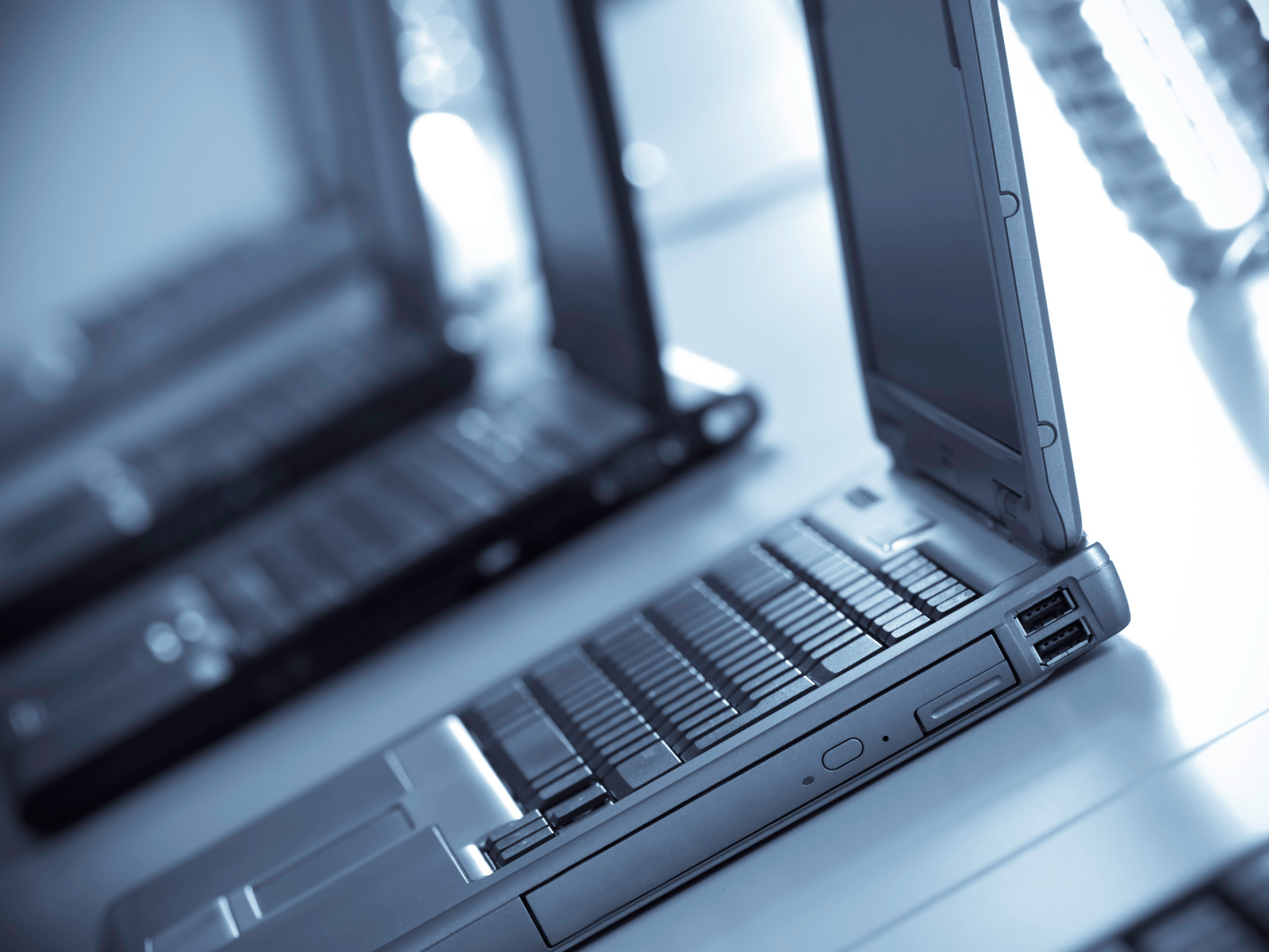 quality black laptops lined up in a row